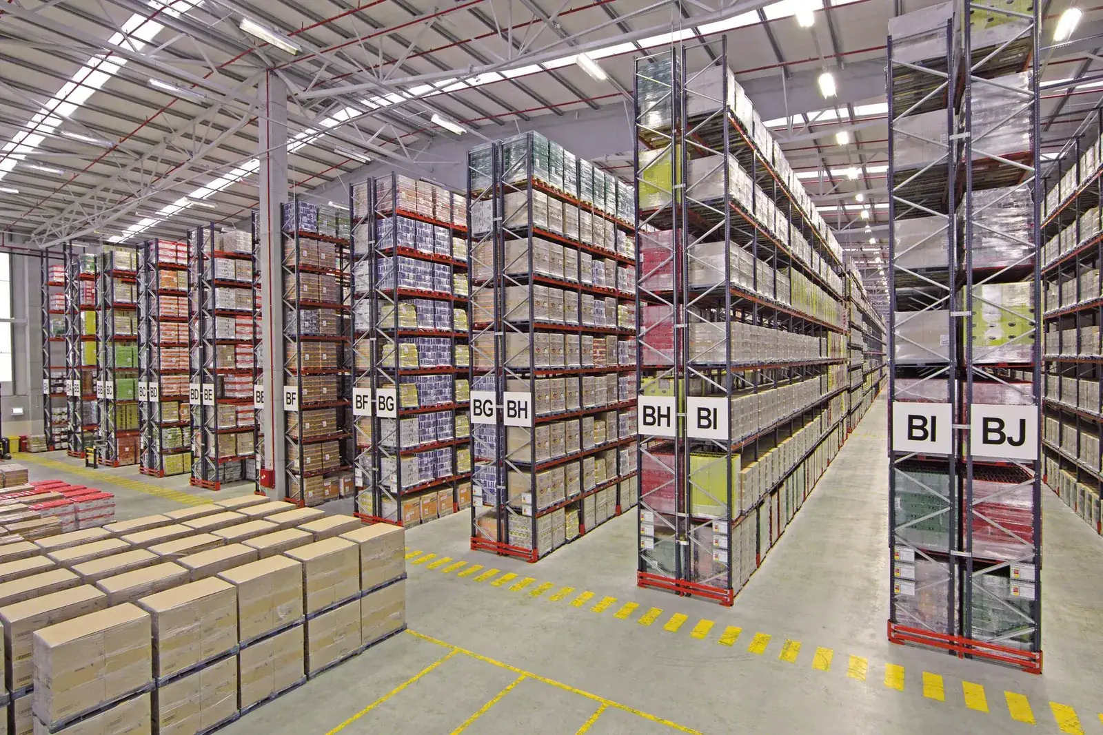 Warehouse aisle with tall pallet racking